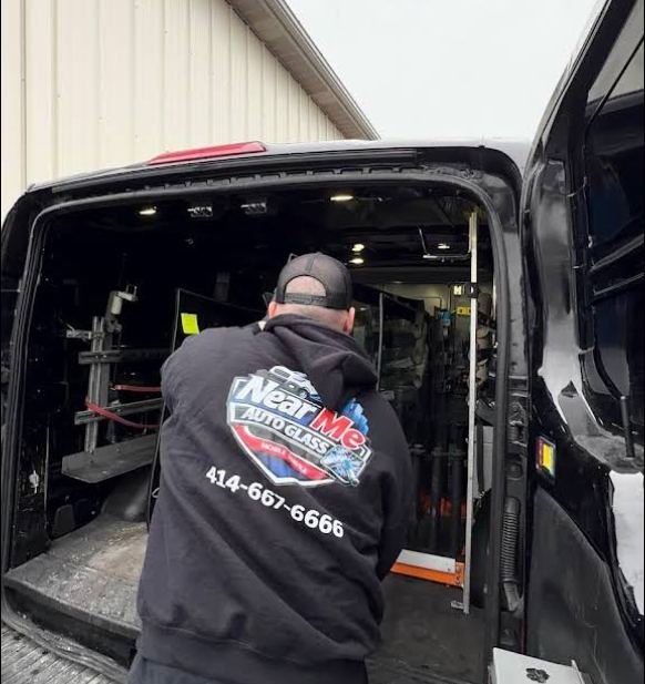 Technician replacing a windshield